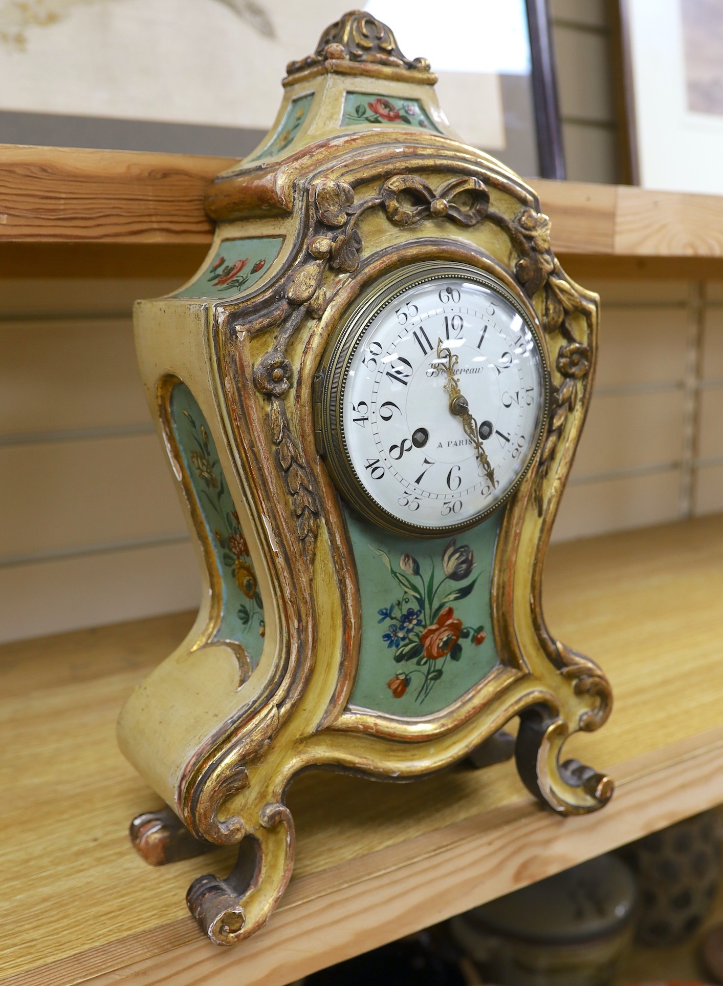 An early 20th century painted French mantel clock, 45cms high